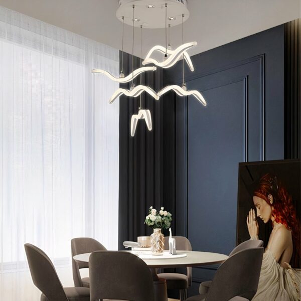 LED vogel hanglamp in Scandinavische stijl boven een eettafel