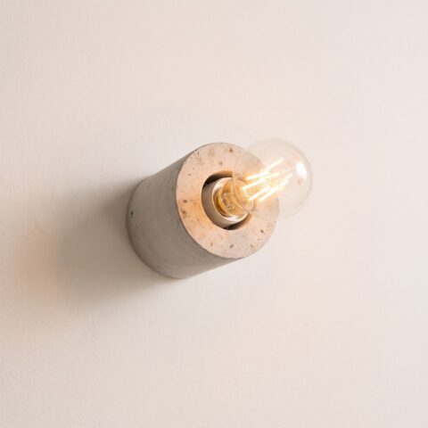 Ronde industriële wandlamp van beton